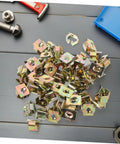 50 Piece Top Shelf Heavy Duty U Nut Fasteners Golden Captive Clips For Car Bumper And Grille Mounting arranged on a work surface.