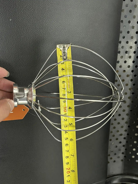 Six Quart Wire Whip Stainless Steel Stand Mixer Accessory Replacement To Whip Up Fluffy Whipped Cream And Egg Whites shown with measuring tape