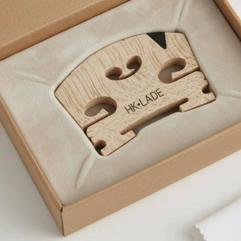 Violin Bridge Maple Replacement Part With Pre Cut String Grooves For No Fuss Install Handcrafted From Aged Maple For Stable Performance And Clear Resonant Tone Perfect For Students And Beginners Looking For An Easy Upgrade, close-up in box
