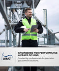 Gas regulator product photo: worker in neon safety vest at gas plant, holding tablet near NMT banner