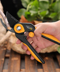 Hand holding Bypass Pruning Shears 8.6 Inch Heavy-Duty Garden Clippers Cuts Up To 1.38 Inch Hardwood With SK5 Titanium Blades Rust-Proof