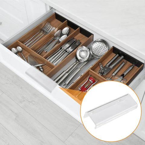 Slick Finger Edge Pulls 8 Pack Modern Drawer Handles on kitchen drawer with utensils, showing curved acrylic self-adhesive design.