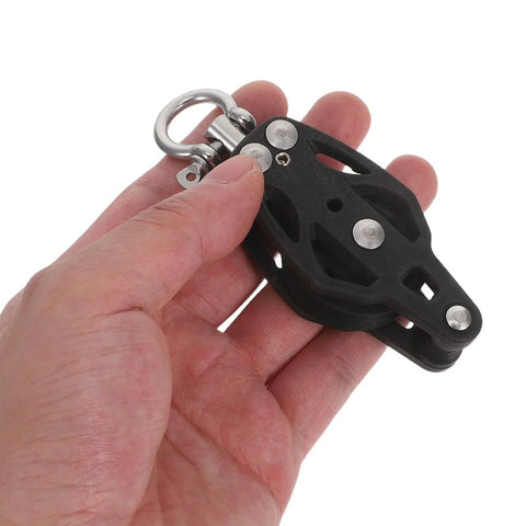 Nylon Single Groove Pulley Block For Sailing And Boating Beefy Tough Marine Wheel Cable Pulley Accessory For Yacht Rope Systems Lightweight Portable And Built To Last Black shown in hand