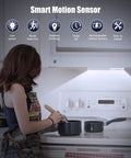 Woman cooking under 30 LED Closet Light With Charging Station And Motion Sensor Under Cabinet Lighting Kit