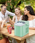 Hella Fast Portable Ice Maker With Built In Handle Makes Twenty Six Pounds Fresh Ice Daily, served at a summer gathering.