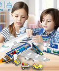 Children assembling Epic City Passenger Airplane Building Set with LED Lights 901 Pieces Plane Construction Kit including terminal and tower