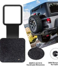 Black Rhinestone Trailer Hitch Cover For 2 Inch Receivers on SUV, showing rhinestone details and universal rubber tube cap.