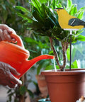 Bird Shaped Soil Moisture Sensor With Long Probe Hygrometer For Indoor And Outdoor Plants Garden Lawn Water Monitor Battery Included Yellow Indicator Light installed in a potted plant.