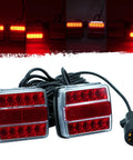Front view: two red LED trailer tail lights with clear lenses, magnetic towing light kit, 24ft cable, 7-pin plug