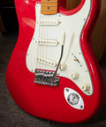 Killer Electric Guitar Output Jack Plate With Quarter Inch Connector aged on red electric guitar body showcasing secure oval shape mono input socket.