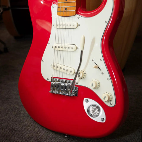 Killer Electric Guitar Output Jack Plate With Quarter Inch Connector aged on red electric guitar body showcasing secure oval shape mono input socket.