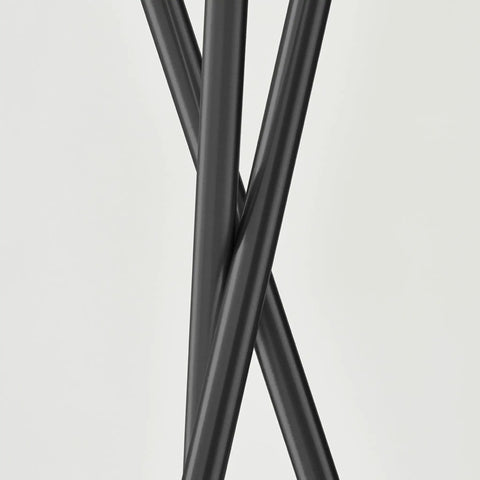 Close-up of black tripod legs from LED Floor Lamp Tall Tripod With Drum Shade In Black Finish And Gold Accents, Modern Living Room
