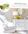 Living room with white armchair and dresser, featuring golden decorative accents and floral arrangement, promoting Ironware Tools.