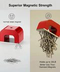 Red cast horseshoe magnet on a two-panel display; nails held by magnet in right panel.
