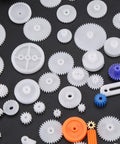 Assorted plastic gears from 78 Piece DIY Gear And Pulley Kit with Plastic Gears Rack Kits and Shaft Belts for Hobbyists and Makers.