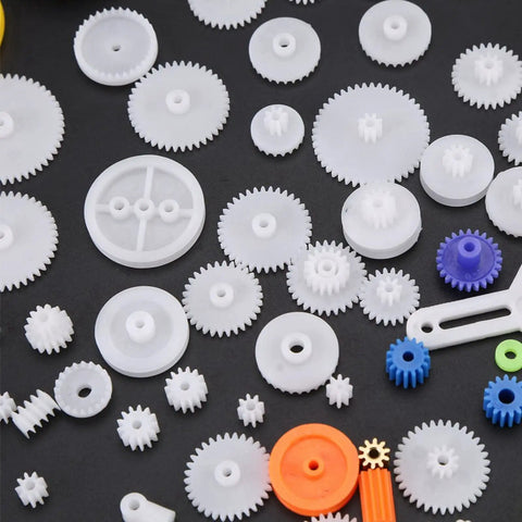Assorted plastic gears from 78 Piece DIY Gear And Pulley Kit with Plastic Gears Rack Kits and Shaft Belts for Hobbyists and Makers.