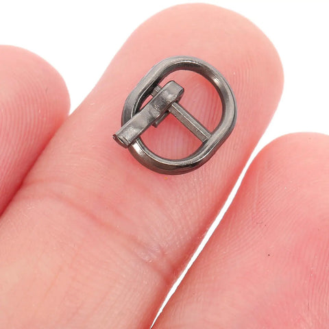Close-up of a tiny alloy buckle for 150 Pcs Mini Alloy Buckles For Doll Clothes And Belts Tiny Sewing Buckles In Silver Gunmetal And Antique