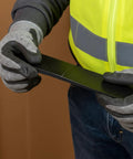 Worker holding Pro Grade 4 Piece 8.75 Inch Welding Wedge Set For Pipe Fitting And Metalworking With Precision Hardened Steel Gap Adjustments