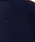Close-up of Western Farm Tractor Trucker Hat With Embroidered Design Custom Text Adjustable Mesh Back Cap in navy and brown polyester.