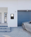 Wall Mount Garage Door Control Panel Switch For Plug And Play Opener Setup on exterior garage wall beside grey door and car