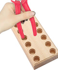 Hand holding pliers next to Wood Pliers Holder With Multi Slot Rack For Beading Tools And Hand Tools Durable Bead Tool Organizer