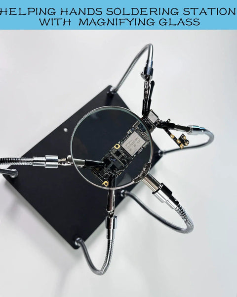 Top view of Helping Hands Soldering Station With Magnifying Glass 2.5X, featuring 4 flexible arms holding a PCB.