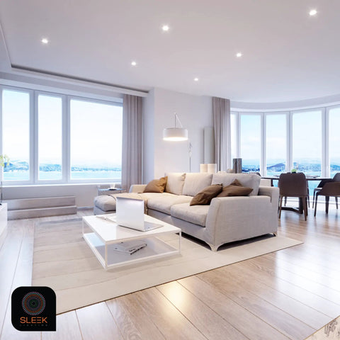 Modern living room with large windows and stylish furniture, brightly lit by GU24 Base 23W CFL Bulbs 1600 Lumens Warm White 3500K