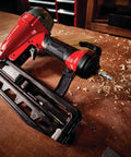Finish Nailer 16 Gauge Pneumatic With Oil Free Motor on wooden bench, showcasing tool free depth of drive adjustment