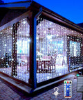 Solar Curtain String Lights For Outdoor Garden 300 LED Fairy Lights with remote on a gazebo at night, patio decor.