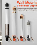 Wall Mounted Coffee Bean Dispenser With Clear Glass Canister And Smooth Wooden Lever For Mess Free Serving keeps coffee beans organized.