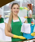 Smiling woman holding cleaning supplies with 200 Pack Cotton Terry Cleaning Cloths 14 by 18 Inches White Bulk nearby