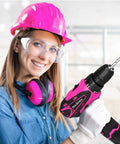 Woman in safety gear holding a pink drill from Pink Drill Set For Women 137 Piece Home Tool Kit With 12V Cordless Drill Charger Battery