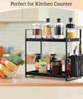 Coffee Station Organizer For Counter With Two Tier Wood Shelves And Three Compartment Pod Storage For Coffee Pods Sugar Tea Bags And Instant Coffee Sleek Black Kitchen Counter Rack For Your Go To Coffee Bar Setup with condiments and cutlery basket