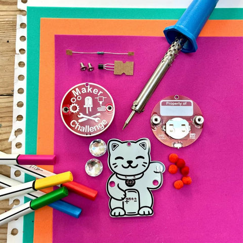 Interactive Transistor Cat Soldering Kit for Beginners and Teens with PCB, soldering iron, and colorful markers.