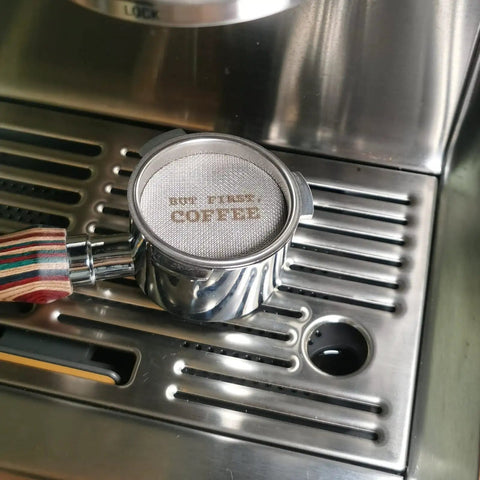 Espresso Puck Screen 53.3mm 1.7mm Thick 150μm Mesh Reusable Filter For 54mm Portafilter Basket 316 Stainless Steel Reduces Channeling And Improves Brew placed in portafilter on espresso machine.