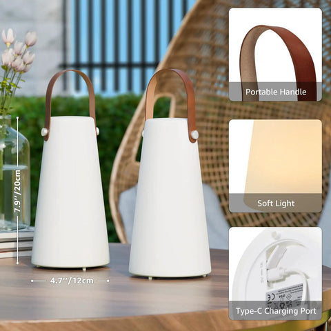Two Pack Rechargeable Outdoor Lanterns with IP44 waterproof cordless portable hanging and table lamps on a patio table