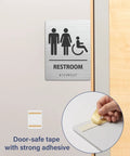 Modern ADA Compliant Restroom Sign Set For Businesses With Braille And Raised Icons, Easy Install, 6 By 8 Inches, Brushed Aluminum, 2 Pack, Door Sign For Accessibility And Compliance showing adhesive backing
