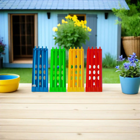 4 Pack Pigeon Ring Stands And Poultry Leg Band Racks in blue, green, yellow, and red on wooden table, garden background.