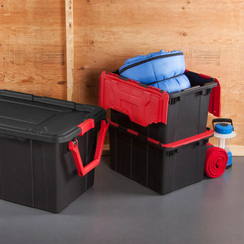 Haul Heavy Loads With Ease Using These Tough As Nails 12 Gallon Storage Totes With Secure Lids For Garage Organization Stackable Heavy Duty Crates Featuring Tie Down Grommets In A Rock Solid 12 Pack Bundle in black and red, filled with blue gear.