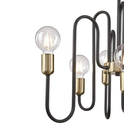 Close-up of Six-Light Indoor Chandelier in Matte Black with Antique Brass accents, showing curved arms and bulb sockets.