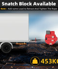 1000 Lb Portable Battery Powered Winch With 40Ft Synthetic Rope And Remote Control Compatible With Milwaukee 18V Batteries Over 4Ah For Heavy Duty Lifting Tasks And Towing Jobs In Red Color No Battery Included, shown in front of trailer with load.