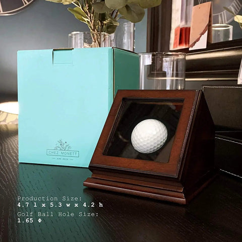 Hole In One Golf Ball Display Case With Wood Frame And Glass Lid Handcrafted Keepsake Box on table next to blue box