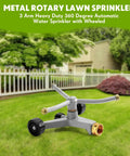 Heavy Duty Metal Rotary Lawn Sprinkler With 3 Arm Automatic Revolving Whirl And Wheeled Base in garden setting