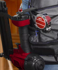 Four Inch L Shaped Pneumatic Tool Rafter Hook Hanger With One Quarter Inch Swivel Fittings Keeps Tools Off The Ground And Hands Free On The Jobsite For Nailer Hammer And Blow Gun With Adapter Two Pack. Red L-shaped pneumatic tool hanger attached to a tool belt with 1/4 in swivel fitting