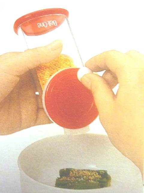 Using Plastic Sesame Grinder White Made In Japan, Handy Kitchen Gadget For Spices And Seeds, Quick No Fuss Grind over bowl