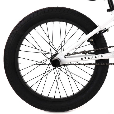 Rear wheel and chain of the BMX Freestyle Bike With Durable Steel Frame In White, Available In 16, 18, 20, 26, And 29 Inch Sizes, 20 Inch Model Included