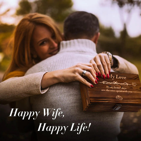 Couple embracing, woman holding engraved wooden box, Romantic Gift Set For Wife With Crystal Preserved Rose And Heart Necklace Engraved I Love You Forever In A Laser Engraved Wooden Keepsake Box For Anniversary Or Birthday Elegant Gift Box Set From Hubby To Surprise Her And Create Lasting Memories.