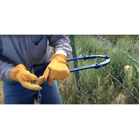 Person using Effortless Fence Fixer Barbed Wire Stretcher And Tightener For Barbed Wire Electric Fence Wire Horse Fencing And Net Wire Fencing 60 Second Stretch For Water Gaps And Short Runs Made In The USA on a wire fence