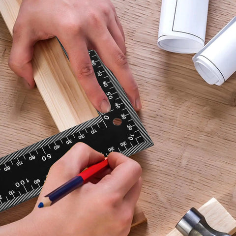 Badass 8X12 Inch Carpenter Square Pro Builder Heavy Duty Carbon Steel Framing Tool used for marking wood on a workbench.