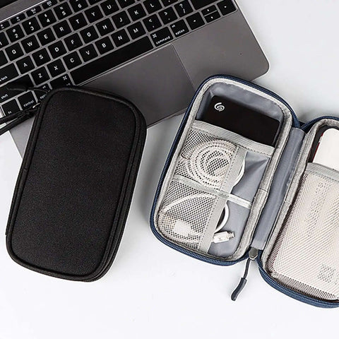 Skip The Cable Knots With This Portable Double Layer Electronic Organizer Travel Case Water Resistant Storage Pouch For Chargers And Gadgets open beside a laptop.
